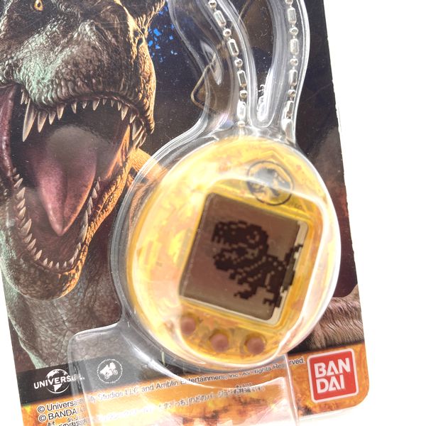 Used] JURASSIC WORLD TAMAGOTCHI - Dinosaur Amber ver. in Box 2022
