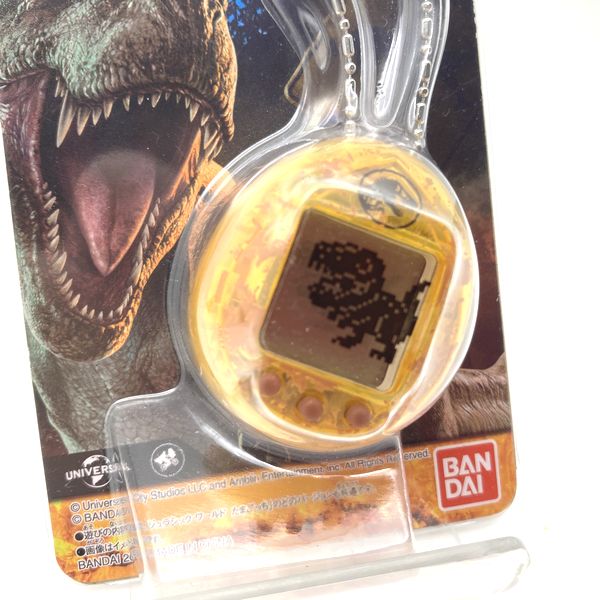 Used] JURASSIC WORLD TAMAGOTCHI - Dinosaur Amber ver. in Box 2022