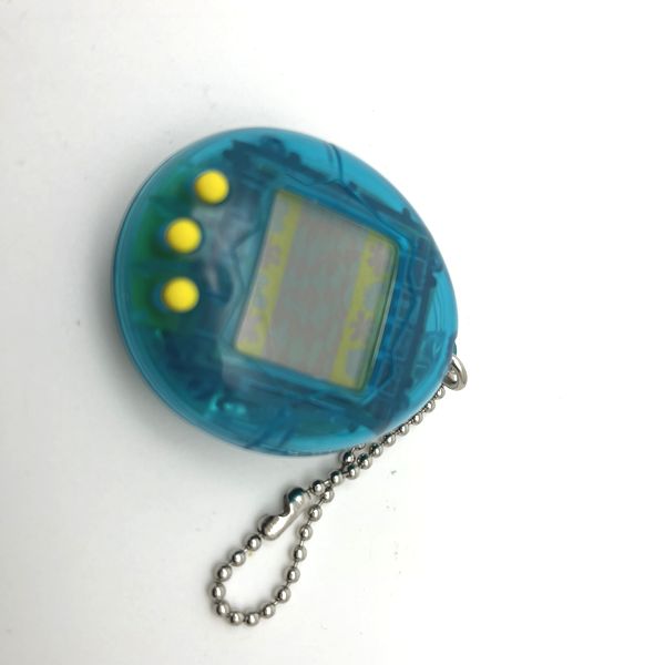 [Usado] Shodai Tamagotchi Azul Transparente Sin Caja Bandai Japón