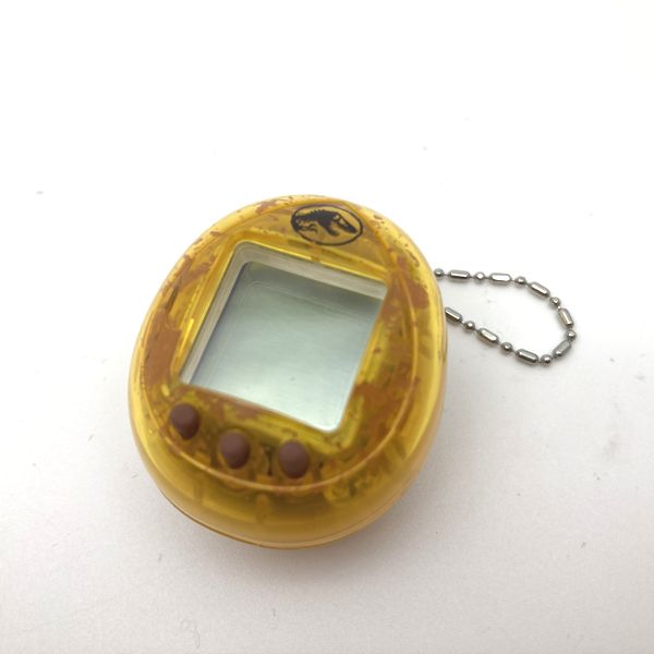 Used] JURASSIC WORLD TAMAGOTCHI - Dinosaur Amber ver. in Box 2022